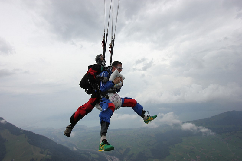 Illustration for article titled Pure Nerd Insanity: Two Men Skydiving with a Girly Hug Pillow